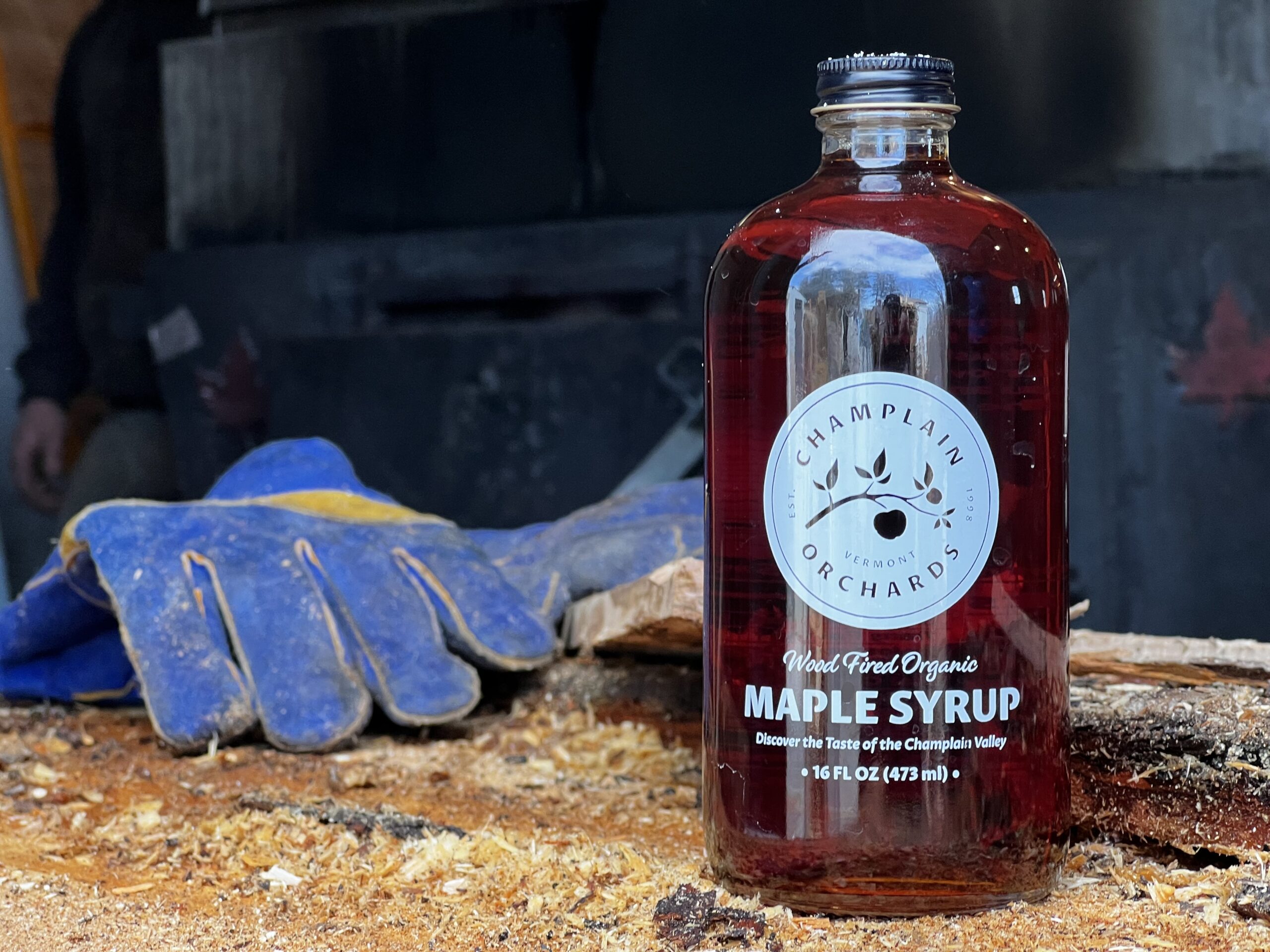 A bottle of Champlain Orchards Organic Maple Syrup.